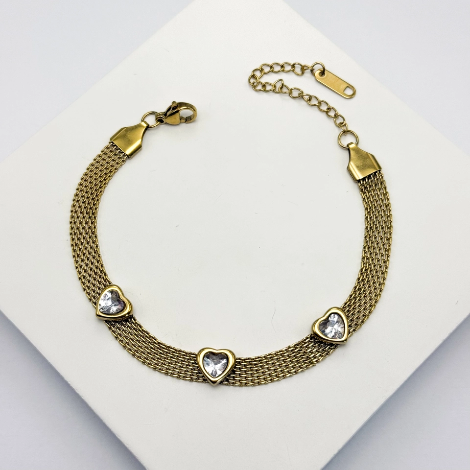 Pulseira aço dourado corações
