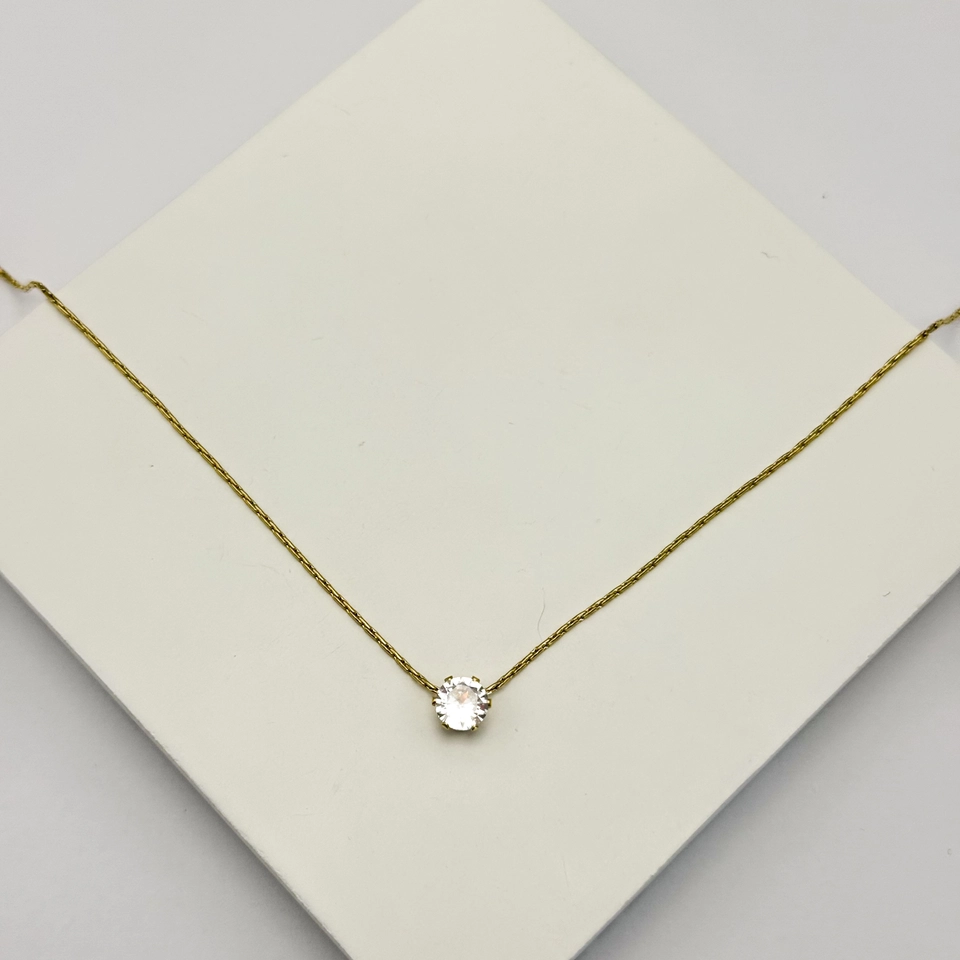 Colar aço dourado ponto de luz