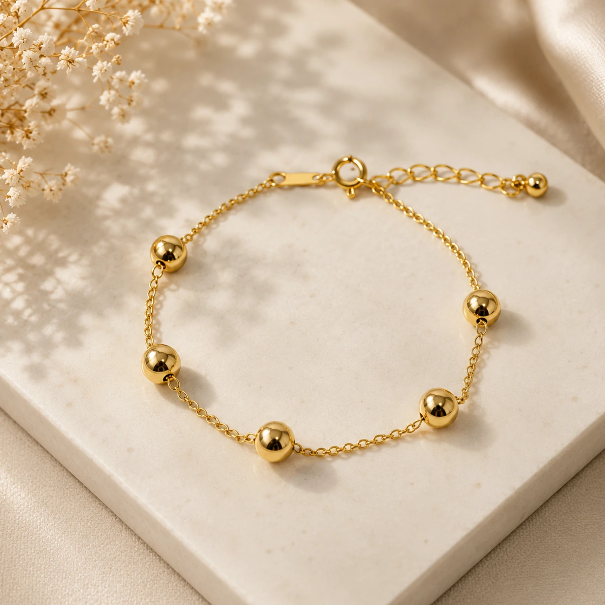 Pulseira dourada esferas lisas