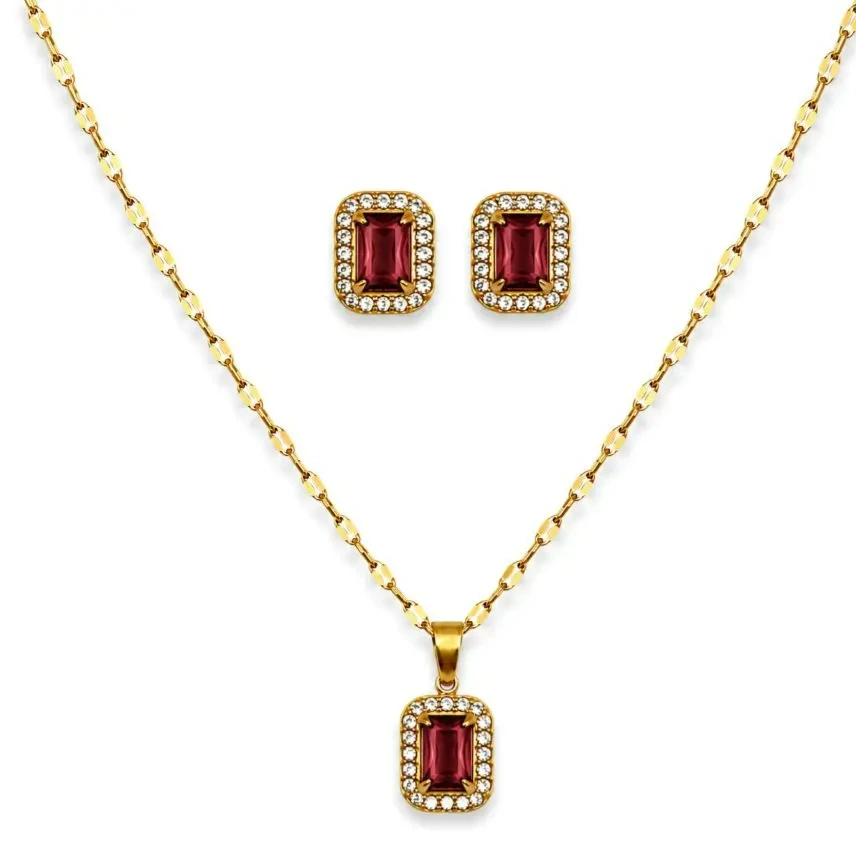Conjunto aço dourado quadrado cravejado vermelho