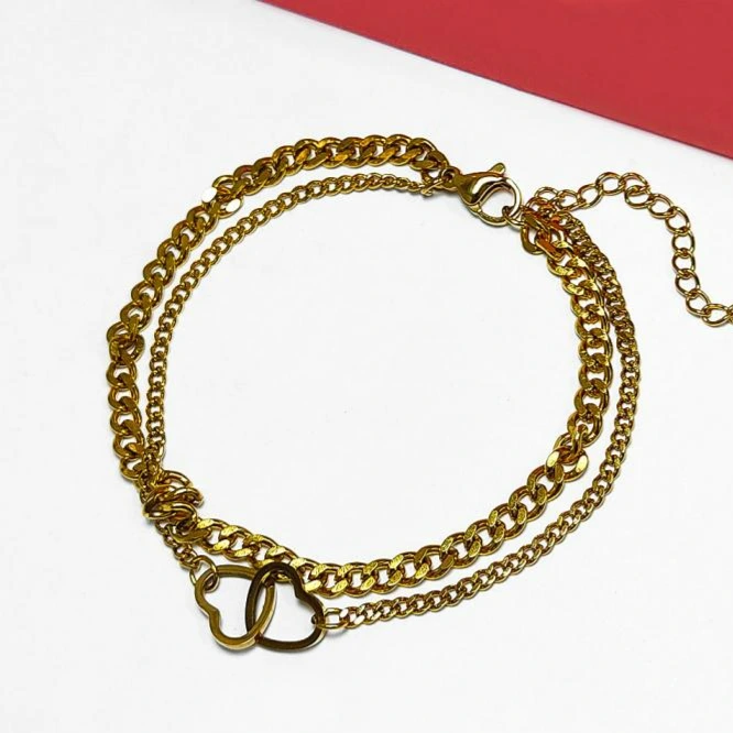 Pulseira aço dourado dupla elos grumet e corações