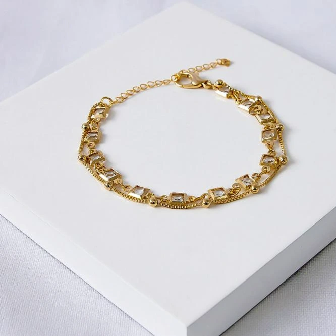 Pulseira dourada dupla bolinhas e ponto de luz