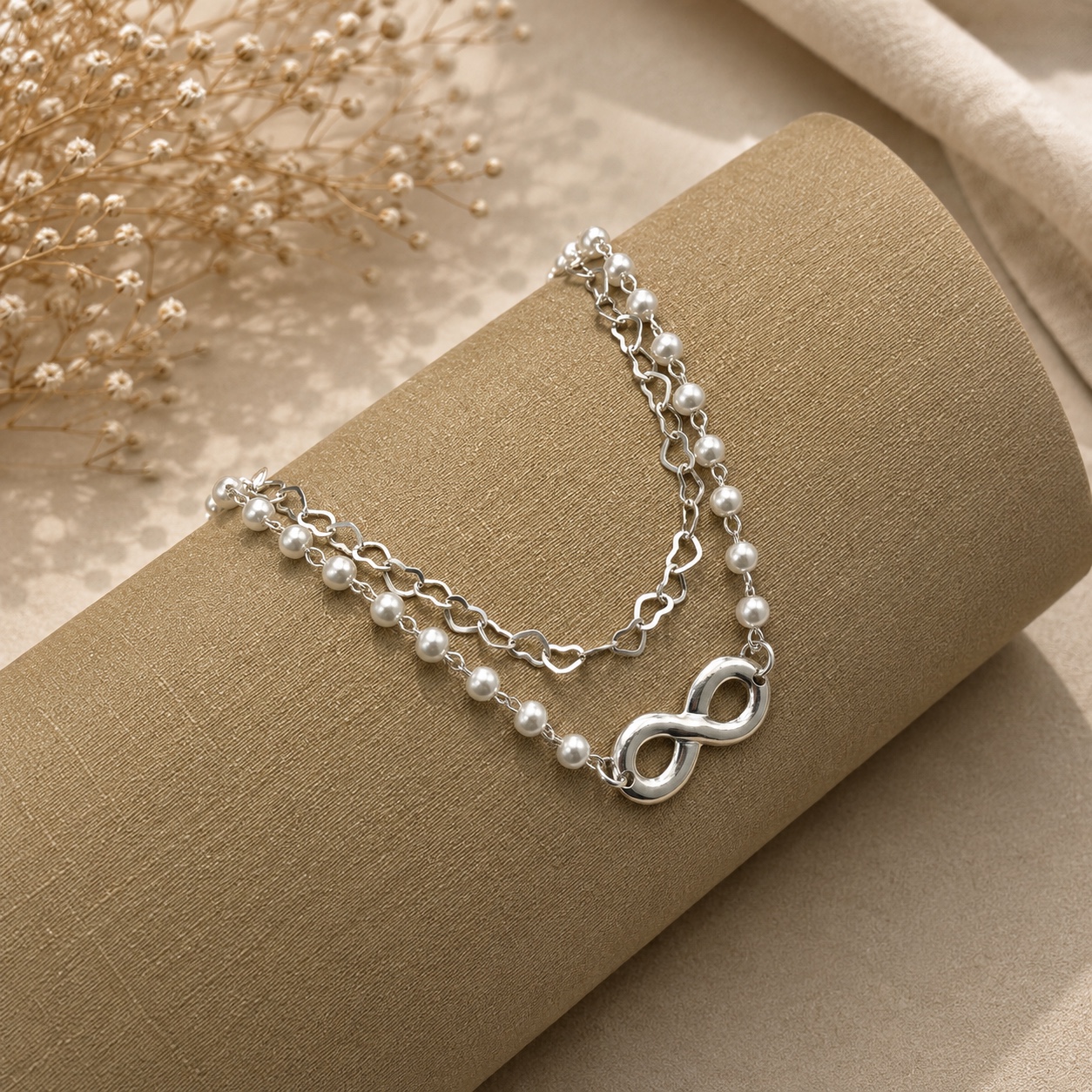 Pulseira prata dupla corações e pérolas com símbolo do infinito