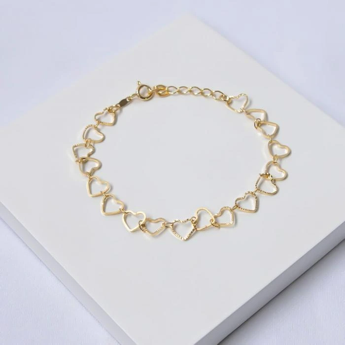 Pulseira dourada corações diamantados