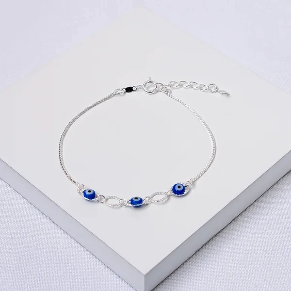 Pulseira prata elos ovais diamantados e olho grego