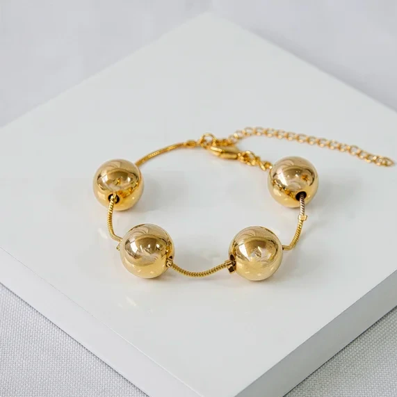 Pulseira dourada esferas G
