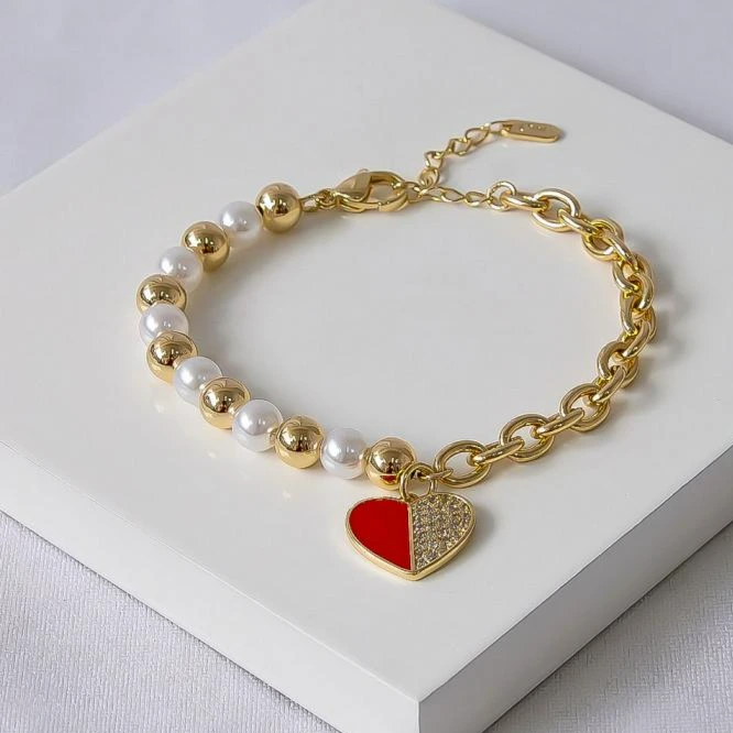 Pulseira dourada coração vermelho cravejado