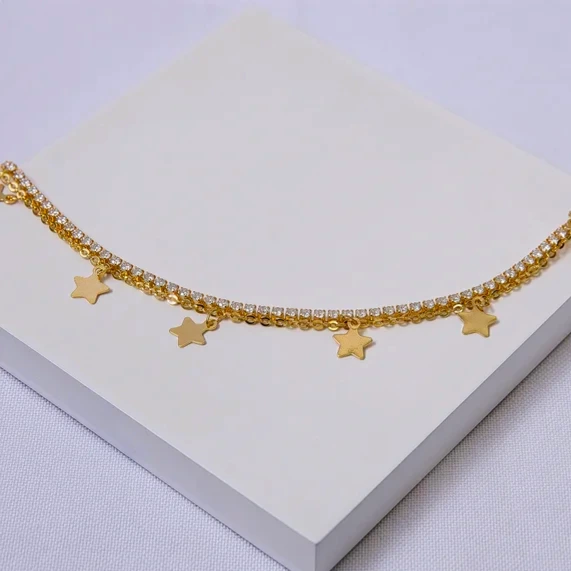 Pulseira dourada dupla riviera e estrelas